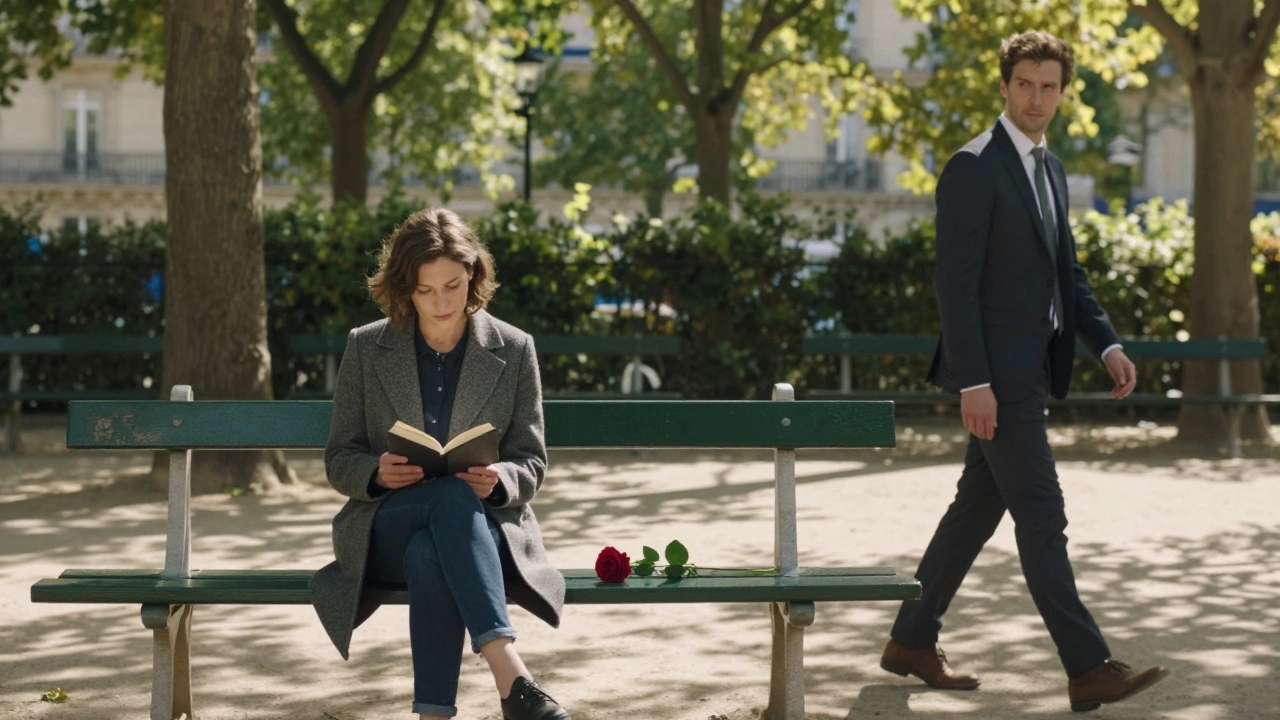 A woman reading on a park bench in Le Marais, a man walking past, a red rose resting between them under dappled sunlight.